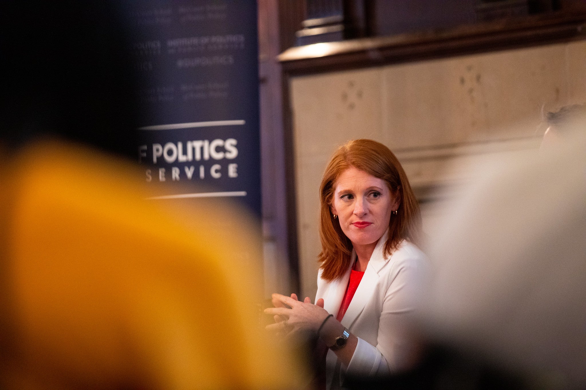 Karen Travers on stage at an event.