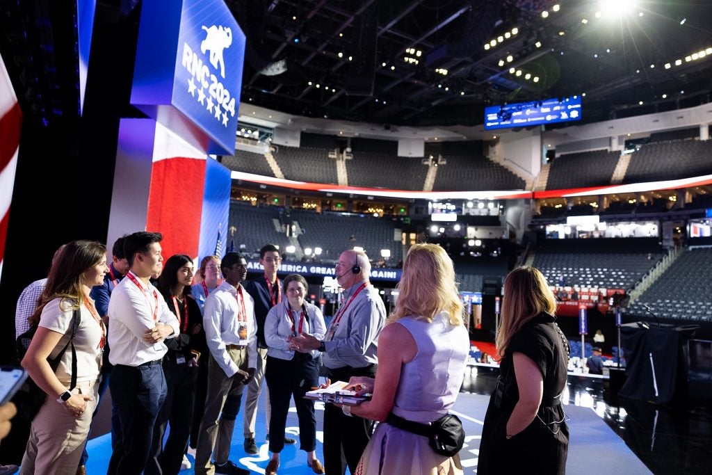 Students on RNC stage listening to stage direction