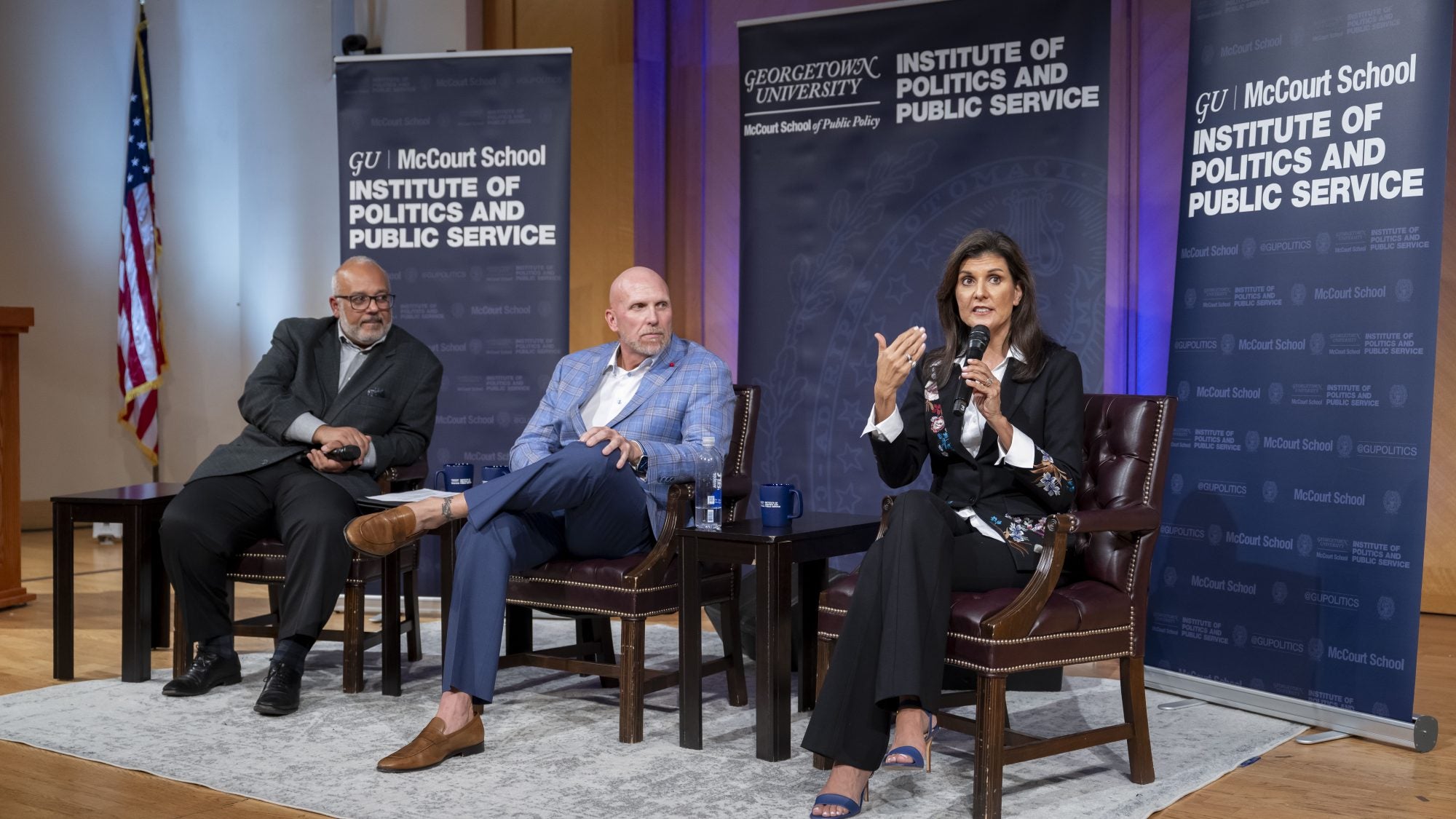 Mo Elleithee, Rick Wiley and Nikki Haley on stage.