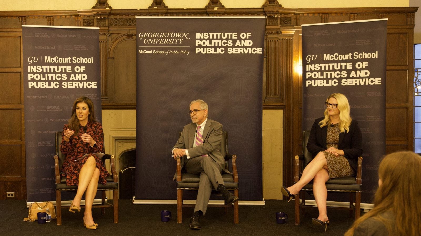 Morgan Ortagus, Tony Arend and Marie Harf seated on stage