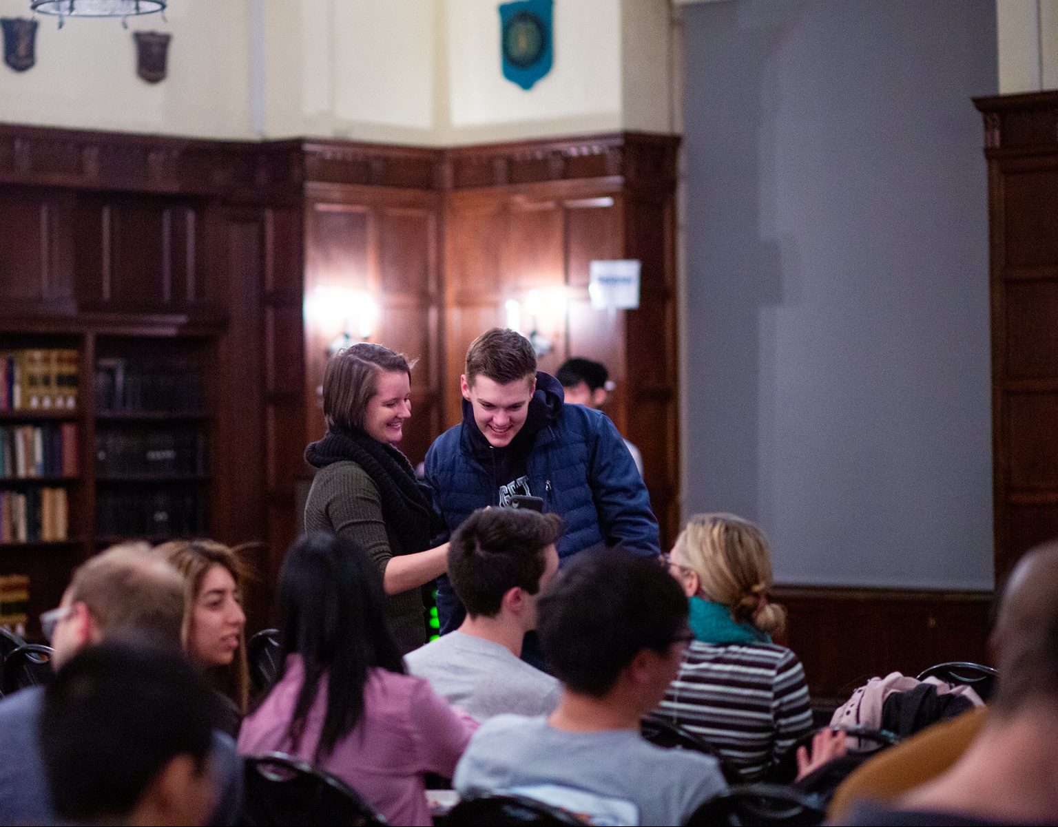 Students in a conversation at an event
