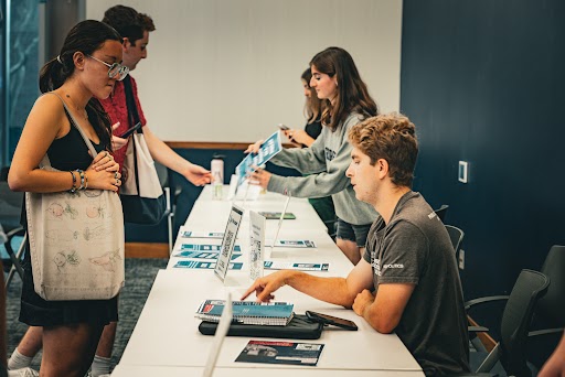 Students tabling for GU Votes.