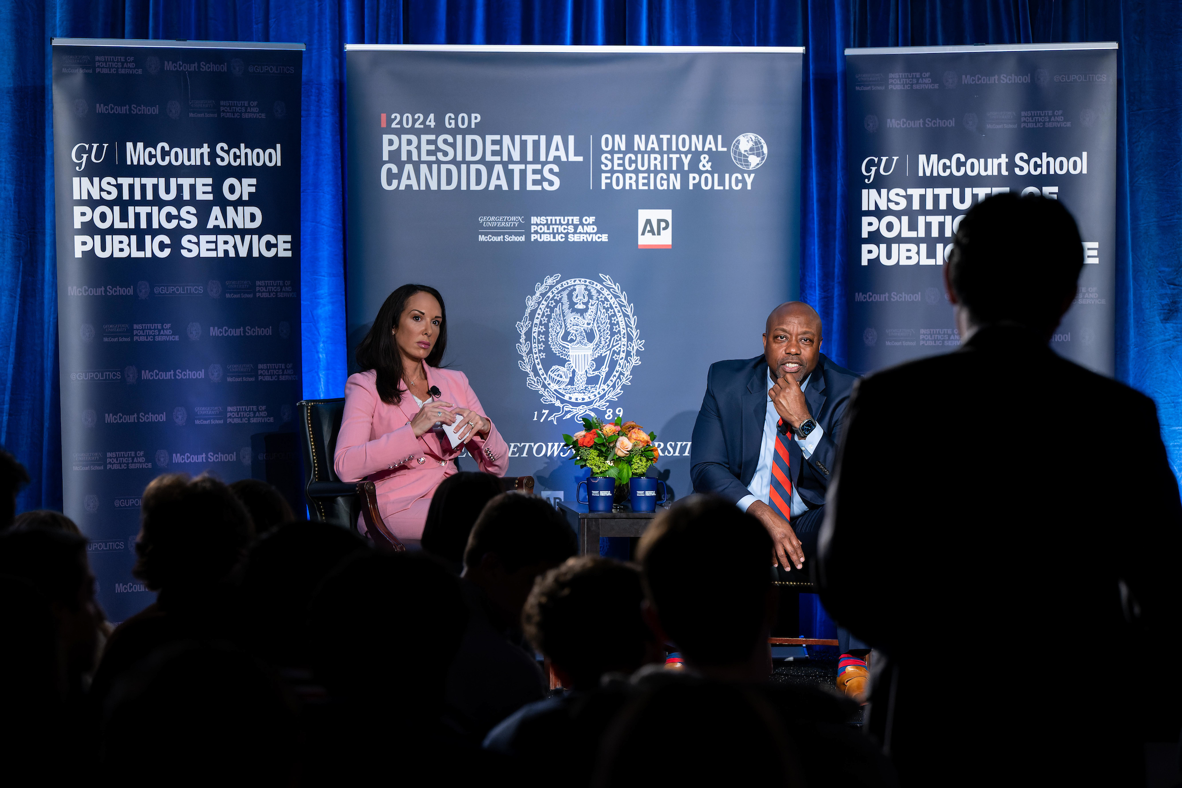 Senator Tim Scott and Meg Kinnard, Washington Bureau Chief at AP, sit on stage. Audience of students in foreground.