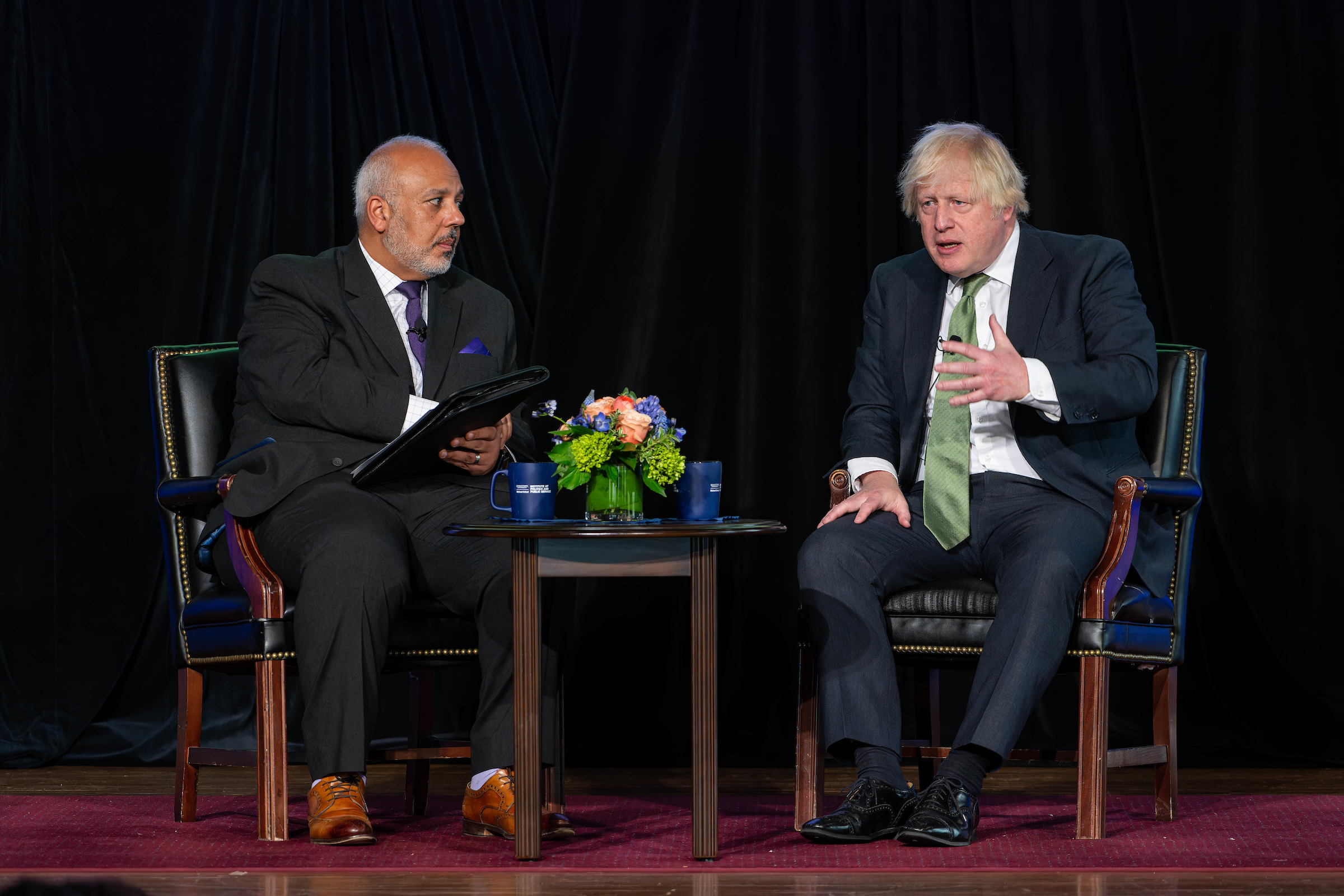 GU Politics Executive Director Mo Elleithee with former UK Prime Minister Boris Johnson on stage.