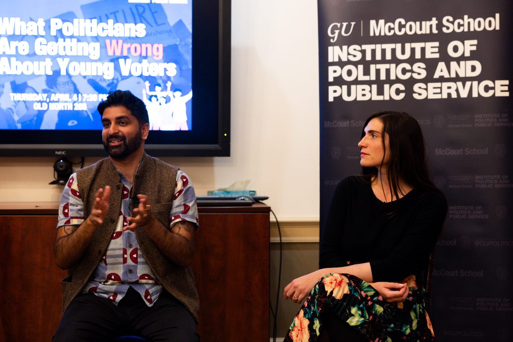 Waleed Shahid speaks as Allegra Kirkland listens.