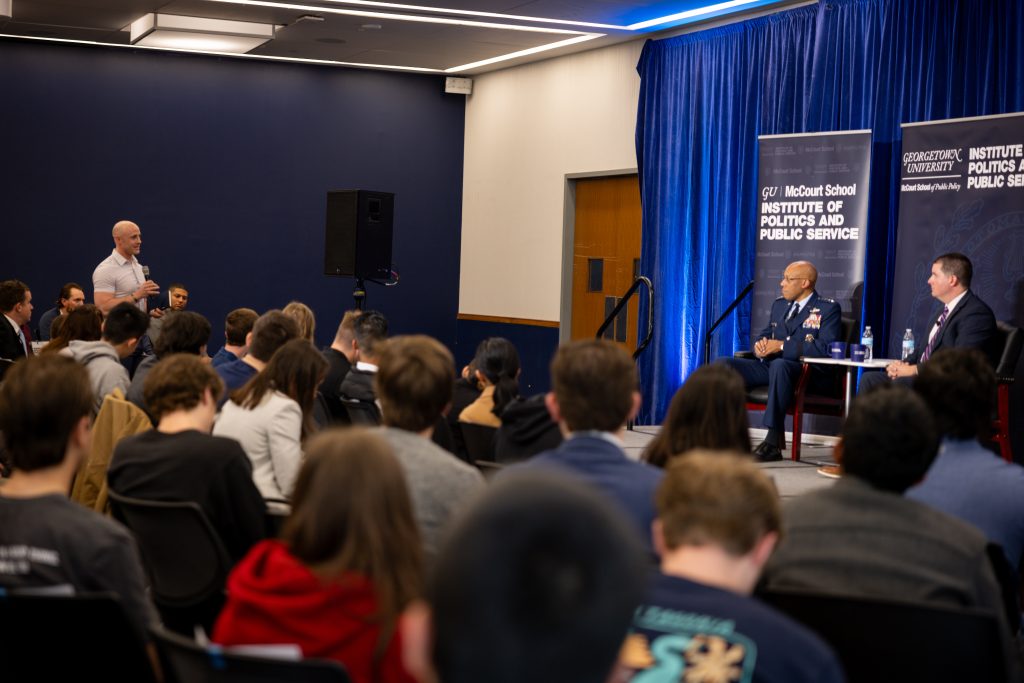 A Bradley Fellow asks a question from the audience as Lamothe and General Brown listen.