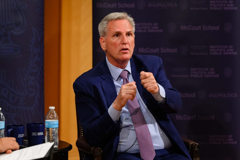Close-up of McCarthy speaking and gesturing.