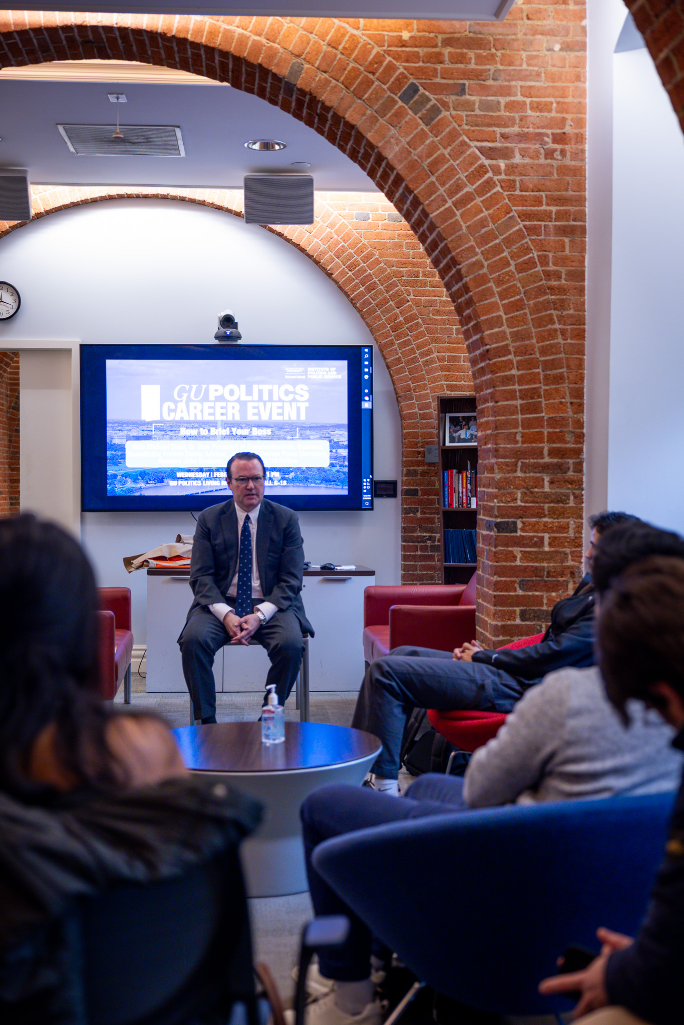 Michael Steel speaks to students in the Living Room.