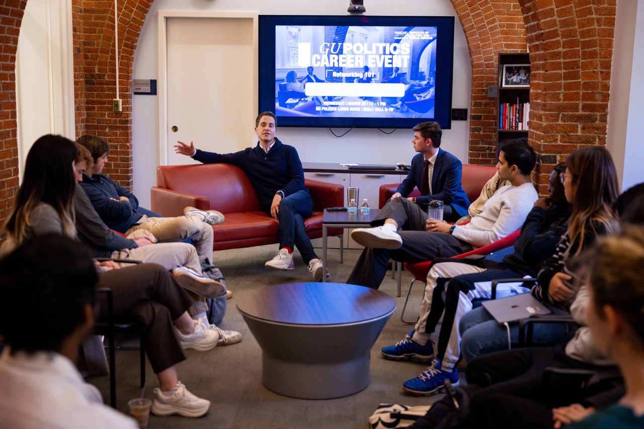 Manatos speaks to students in the Living Room.