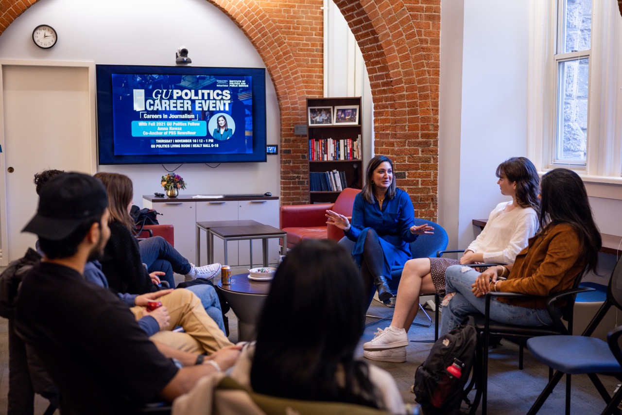 Amna Nawaz speaks to students in the Living Room.