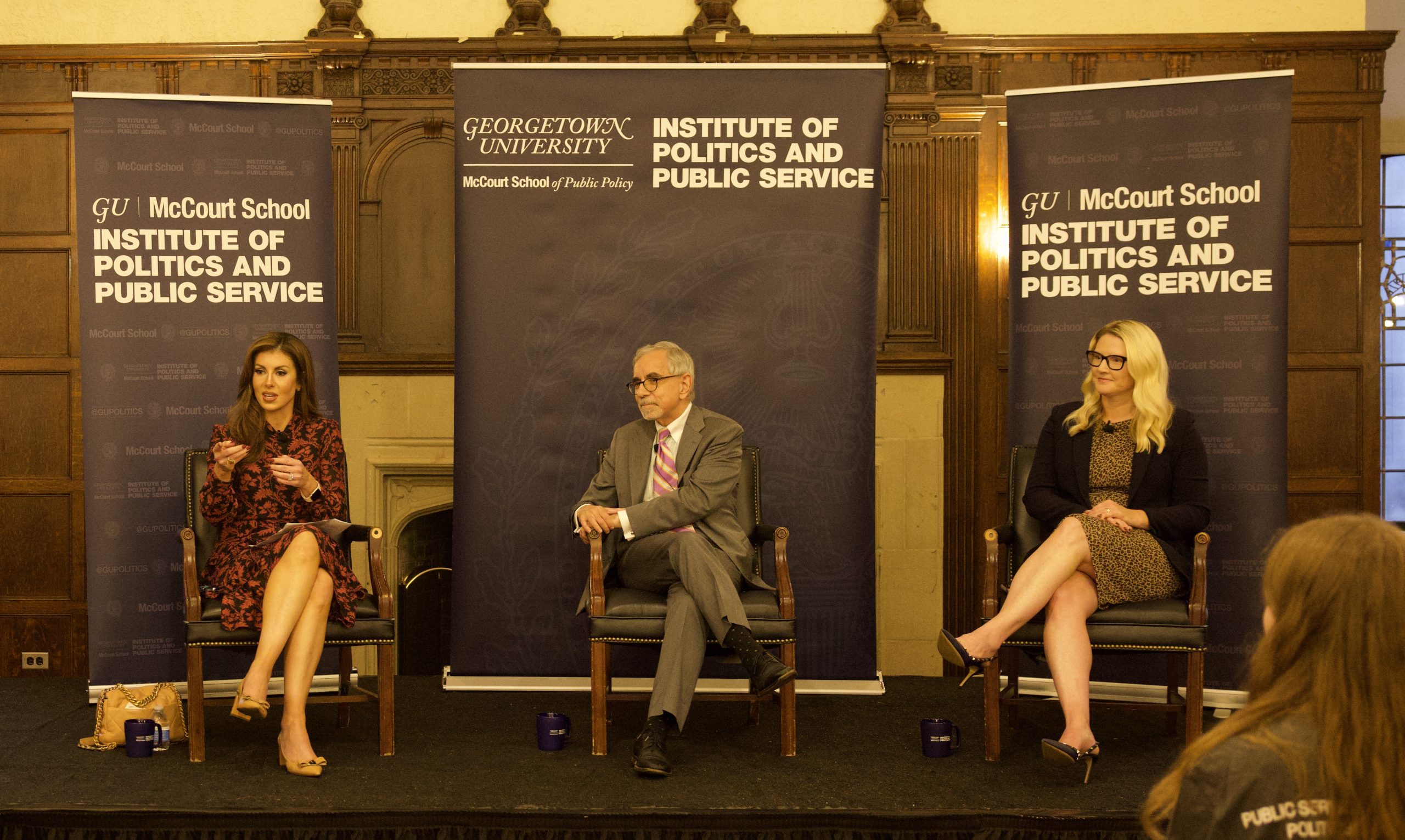 Morgan Ortagus, Tony Arend and Marie Harf seated on stage